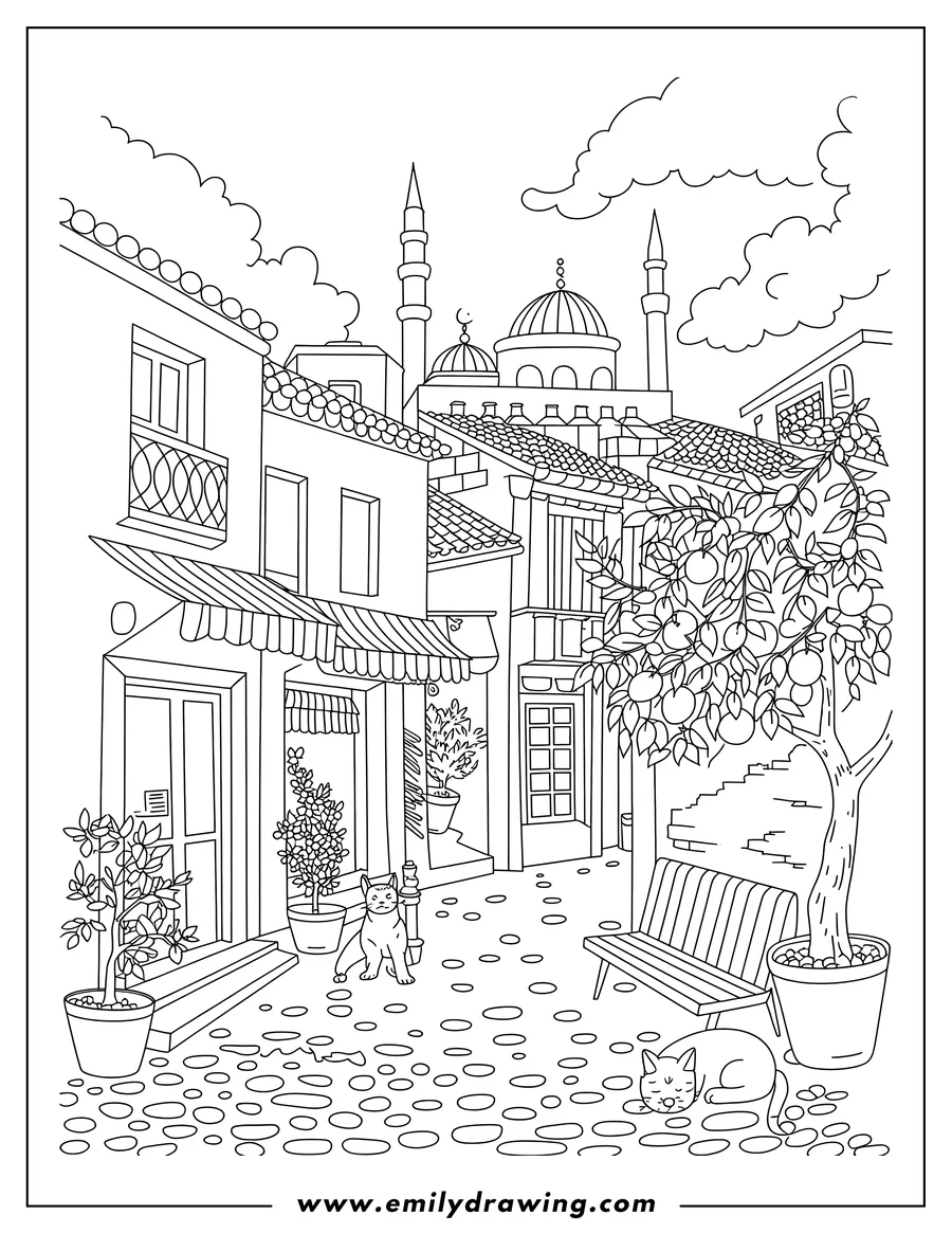 Two cats in a city street with a mosque in the background. One cat is awake and sitting; the other is asleep near a bench.