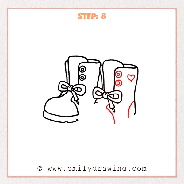 how to draw a boots - Step 8: Eyelets, a small heart, and a heel curve are added to the second boot.